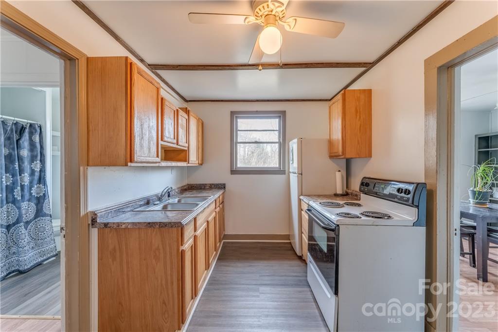 26 Markley Drive East Flat Rock, NC 28726 - Photo 8 of 27 a kitchen with stainless steel appliances granite countertop a stove and a sink