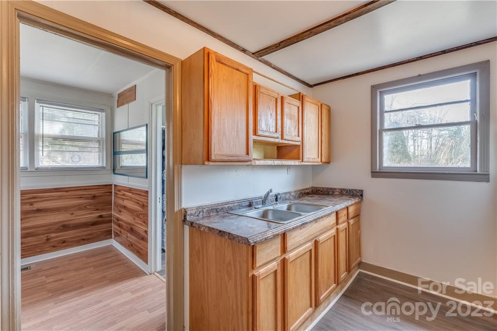 26 Markley Drive East Flat Rock, NC 28726 - Photo 9 of 27 a utility room with stainless steel appliances granite countertop a stove and a refrigerator