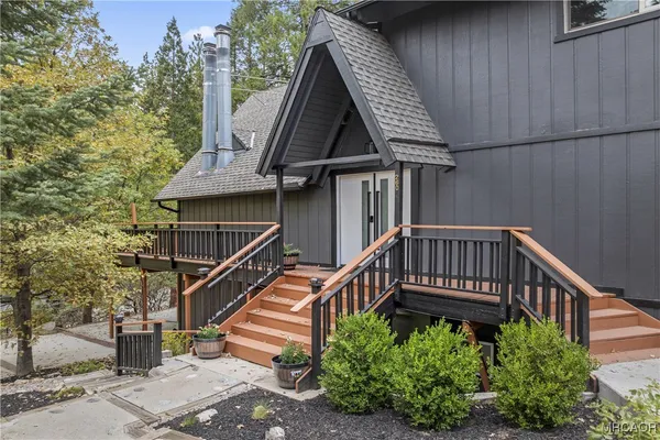 a bed room with a bed and wooden floor