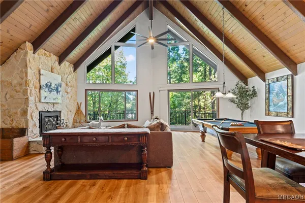 a bedroom with bed and a large window