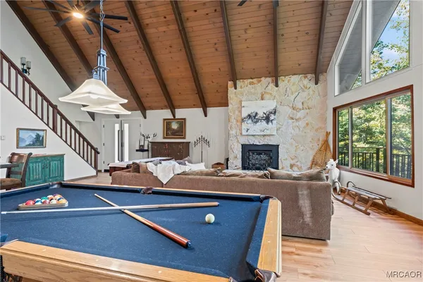 a bathroom with a sink a toilet a mirror and shower