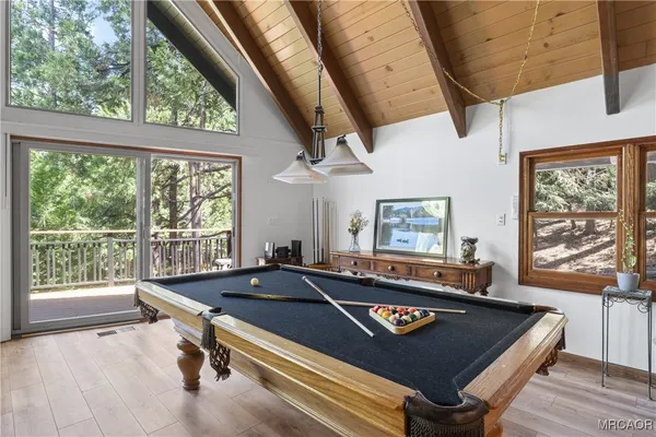 a view of a living room with furniture and a large window
