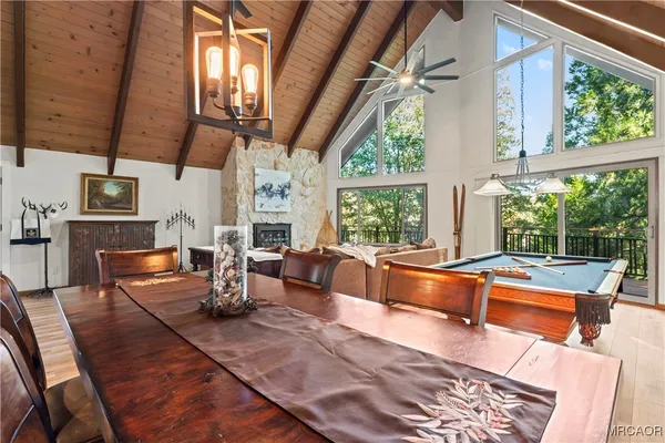 a living room with patio furniture and a large window
