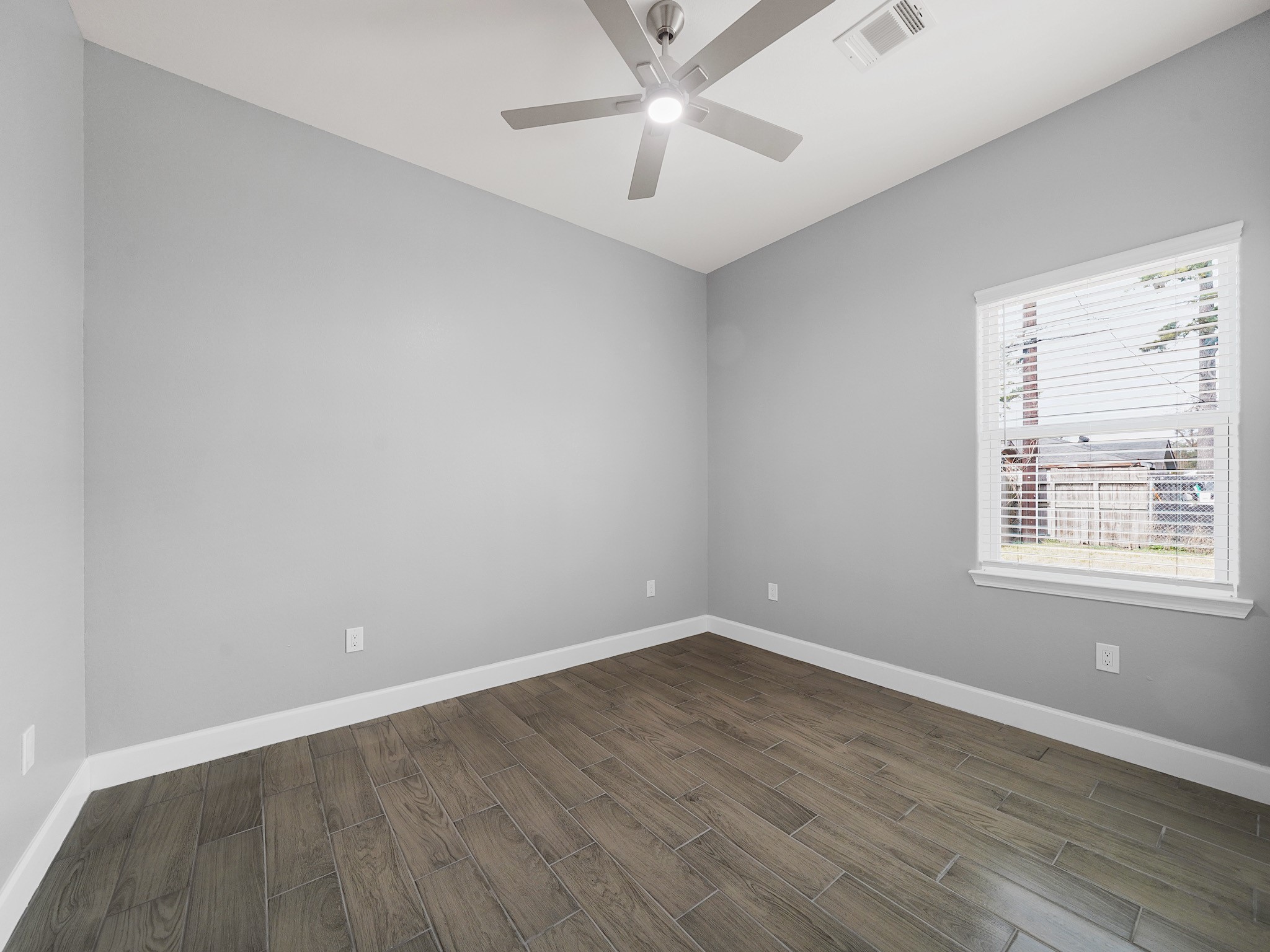 2448 Areba Street Houston, TX 77091 - Photo 14 of 19 A comfortable secondary bedroom with great natural light—perfect for guests, family, or a home office setup.