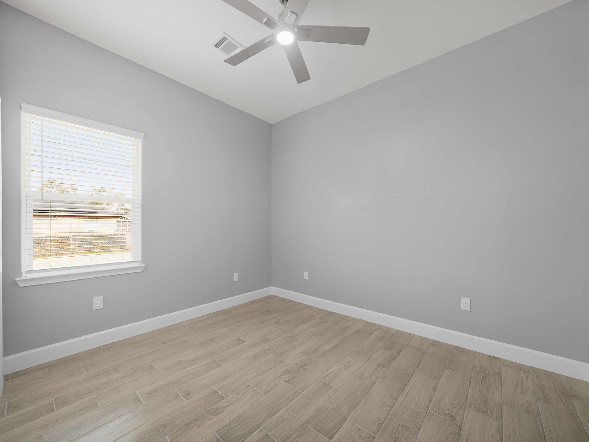 2448 Areba Street Houston, TX 77091 - Photo 16 of 19 Another versatile bedroom offering flexible space for work, hobbies, or additional sleeping quarters.