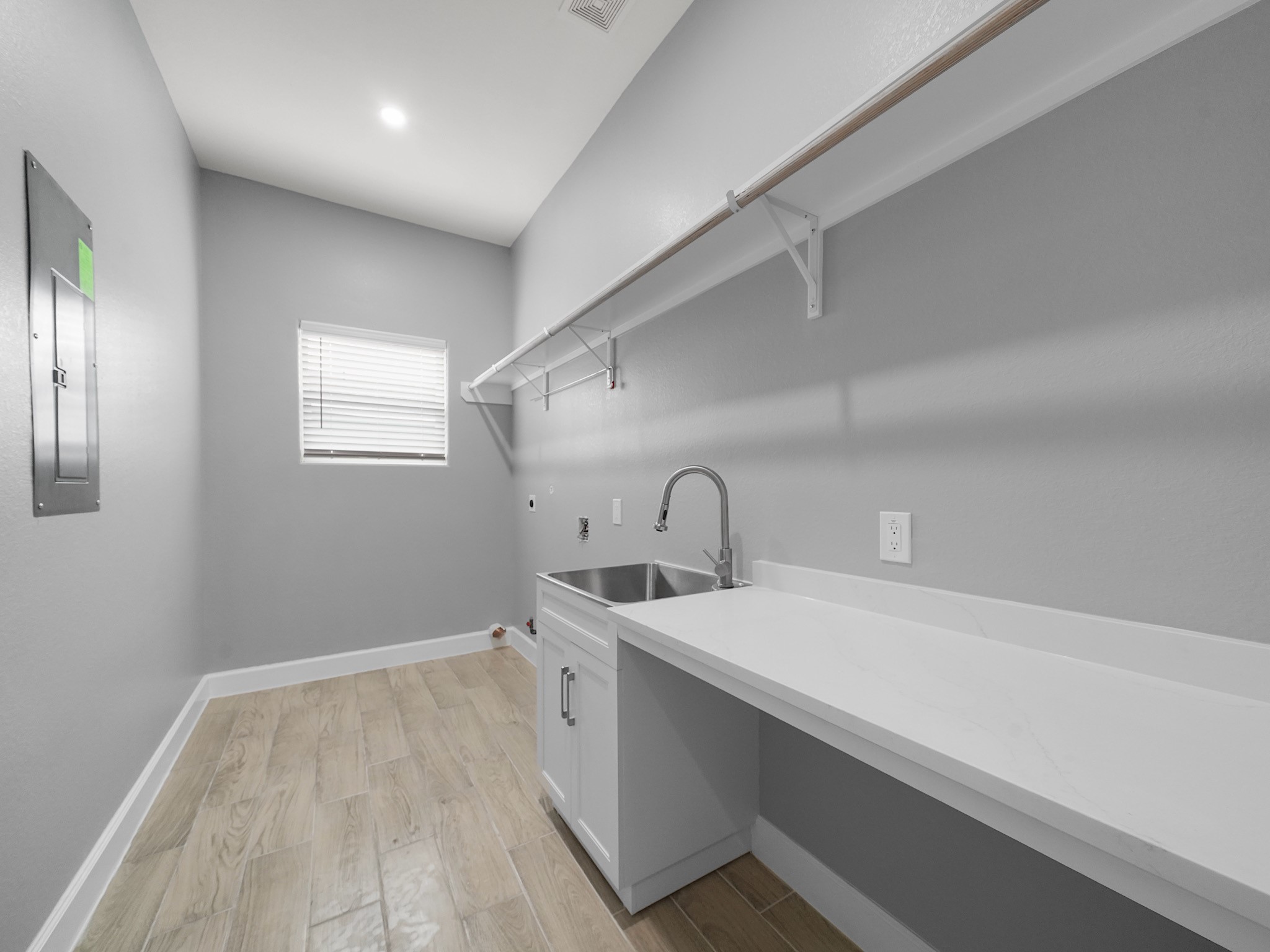 2448 Areba Street Houston, TX 77091 - Photo 18 of 19 Enjoy the convenience of a dedicated utility room inside the home, making laundry day simple and efficient.