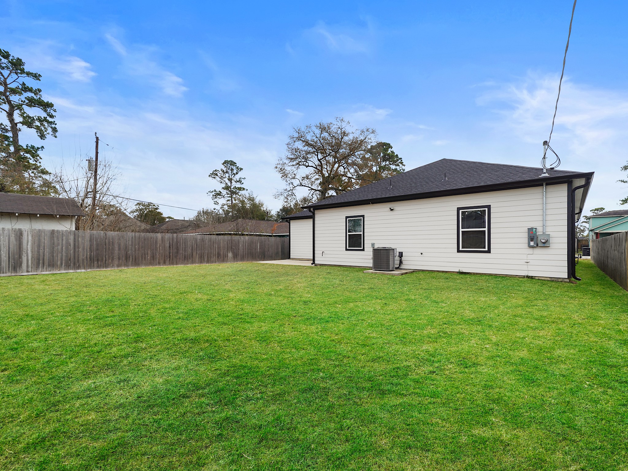 2448 Areba Street Houston, TX 77091 - Photo 19 of 19 The fully fenced backyard with patio creates a private outdoor space perfect for relaxing evenings, weekend barbecues, or quiet morning coffee.