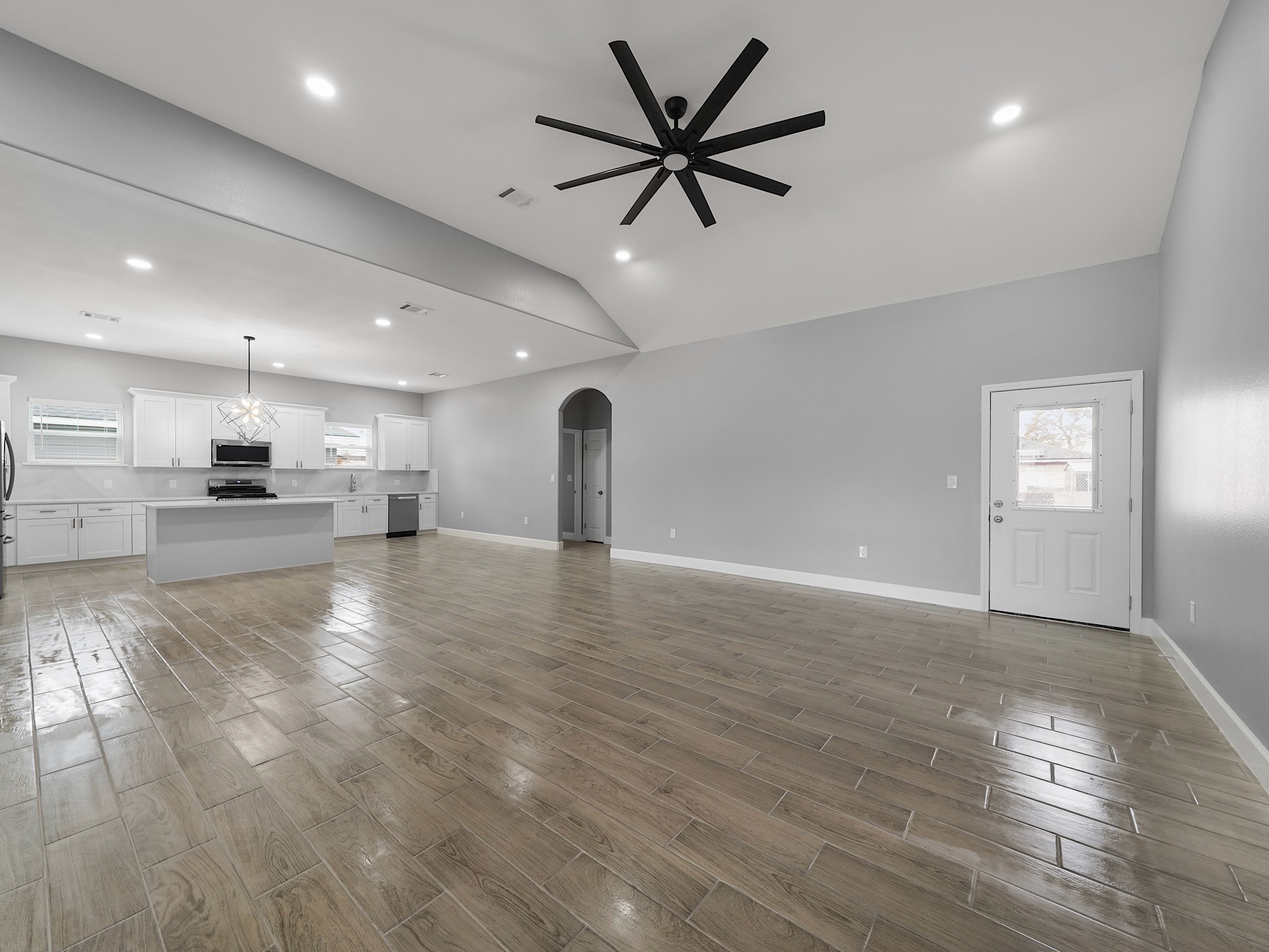 2448 Areba Street Houston, TX 77091 - Photo 5 of 19 The spacious family room is designed for everyday comfort and easy entertaining, filled with natural light and anchored by clean modern finishes.