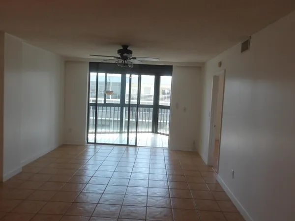 a view of an empty room with a window
