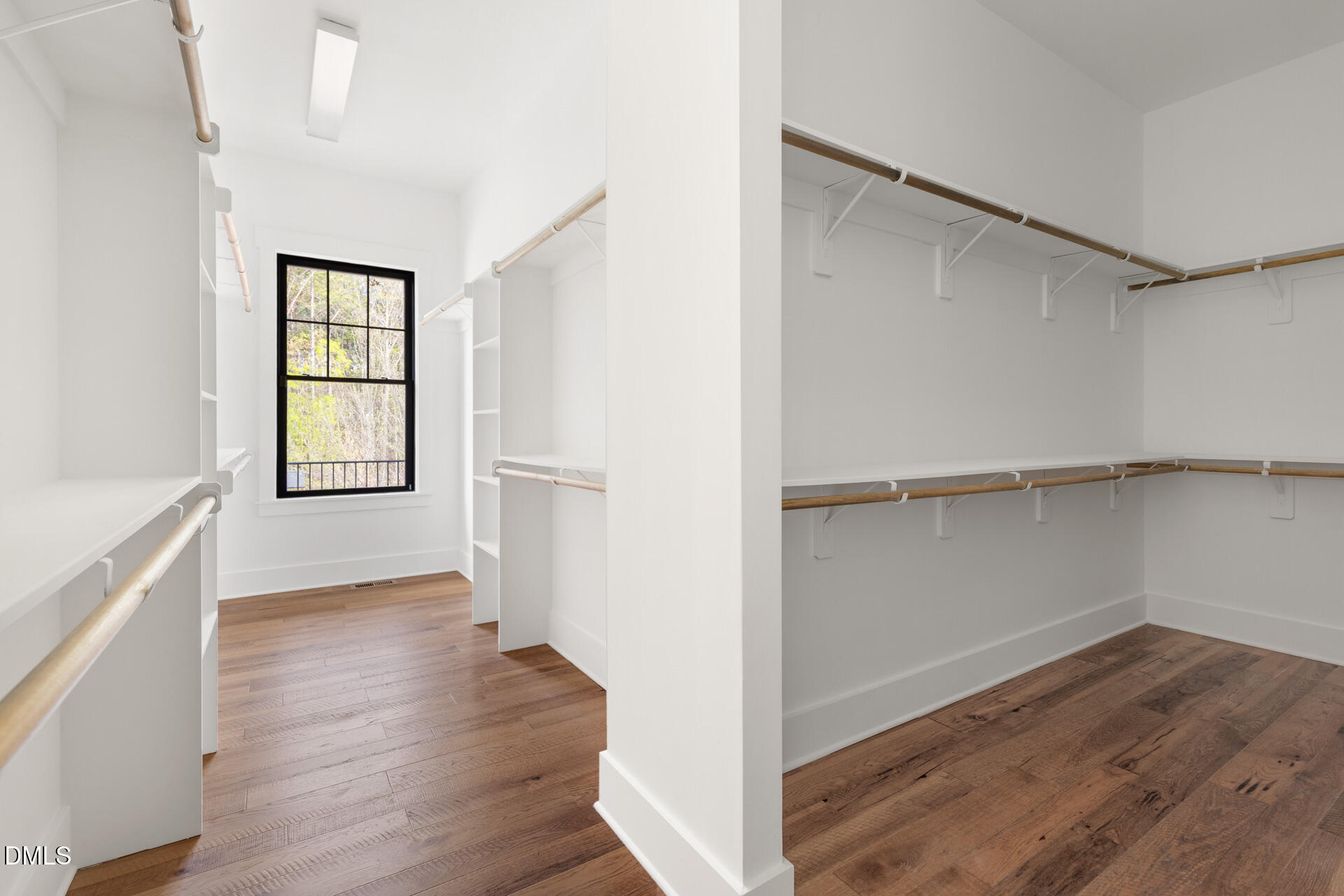 1117 Barley Stone Way Raleigh, NC 27603 - Photo 29 of 59 an empty room with wooden floor cabinet and windows