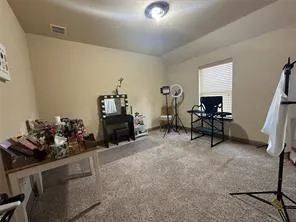 a room with furniture and gym equipment