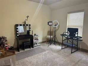 a view of a livingroom with furniture and a fireplace