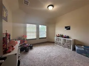 a room with a bed and a window