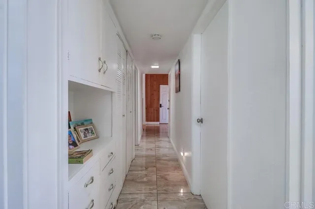 a view of a hallway view with wooden floor and staircase