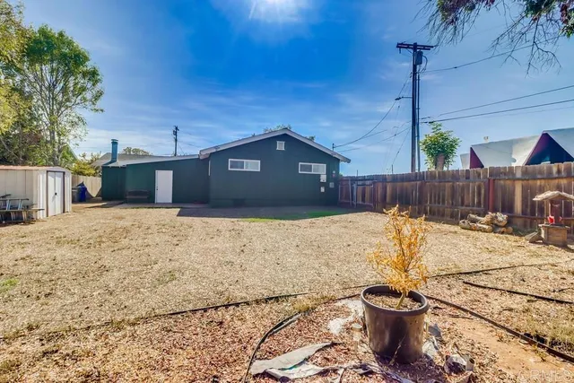 a large bed sitting in a bedroom next to a window