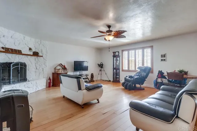 a living room with furniture fireplace and a flat screen tv