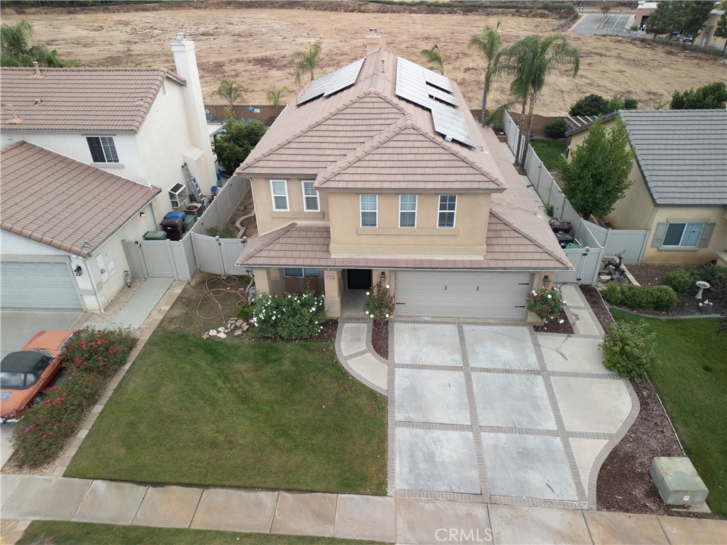 1464 Augusta Street Beaumont, CA 92223 - Photo 2 of 32 a front view of a house with a garden