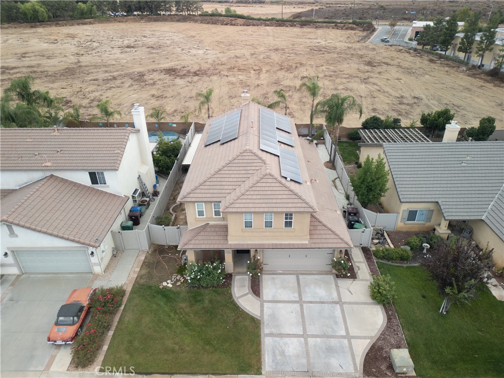 1464 Augusta Street Beaumont, CA 92223 - Photo 30 of 32 an aerial view of a house with a yard