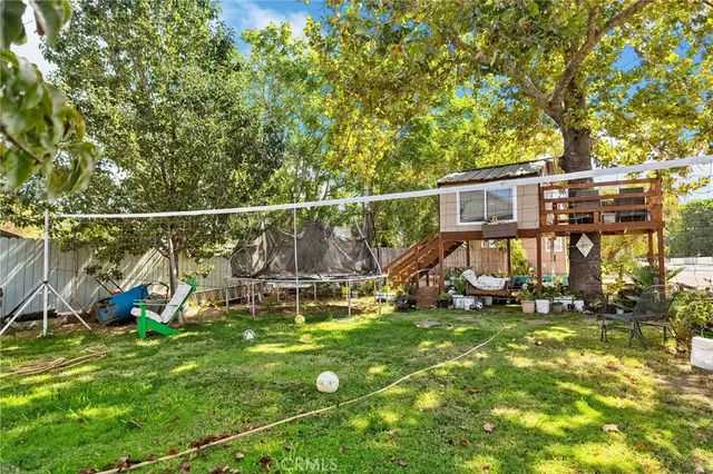 a view of a park with iron fence
