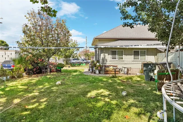 a front view of house with yard and outdoor seating