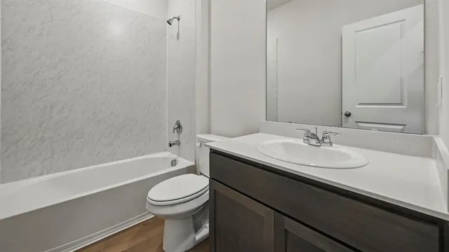 a bathroom with a sink a toilet and a bathtub