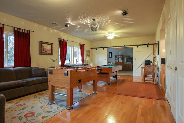 1050 Spring Road Shelter Cove, CA 95589 - Photo 23 of 42 a living room with furniture a chandelier and a dining table