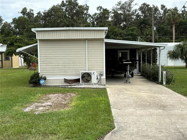 a view of house with backyard space