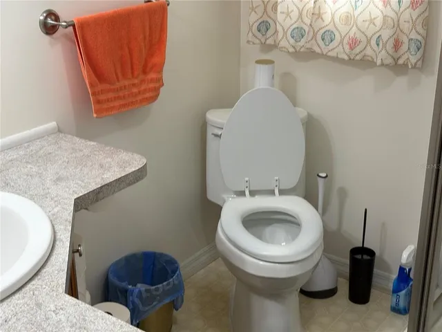 a bathroom with a toilet and a sink