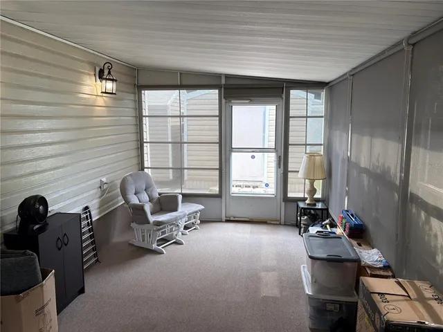 a room with gym equipment and a large window