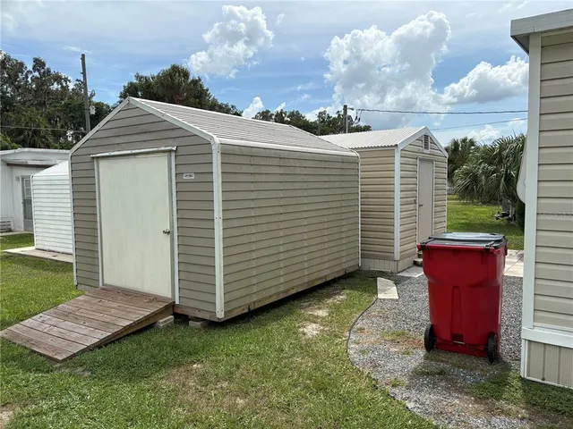 a view of a backyard with a large tree