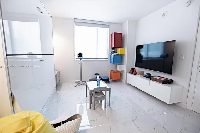 a spacious bathroom with a sink toilet and shower