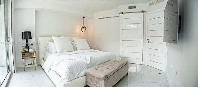 a bedroom with a bed and a cabinets