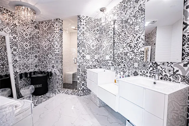 a bathroom with a sink toilet and shower