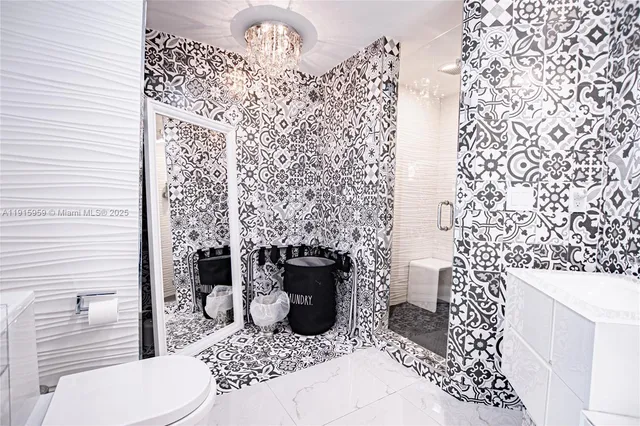 a bathroom with a toilet and a shower curtain
