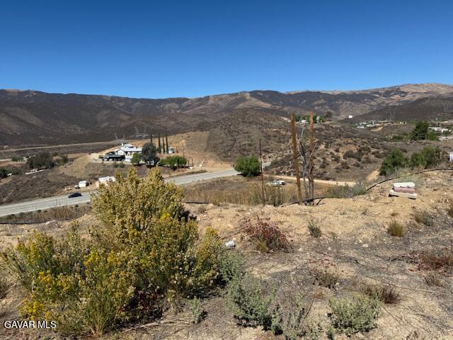 Pellona Road Road Agua Dulce, CA 91390 - Photo 3 of 4 a view of a mountain with wooden fence