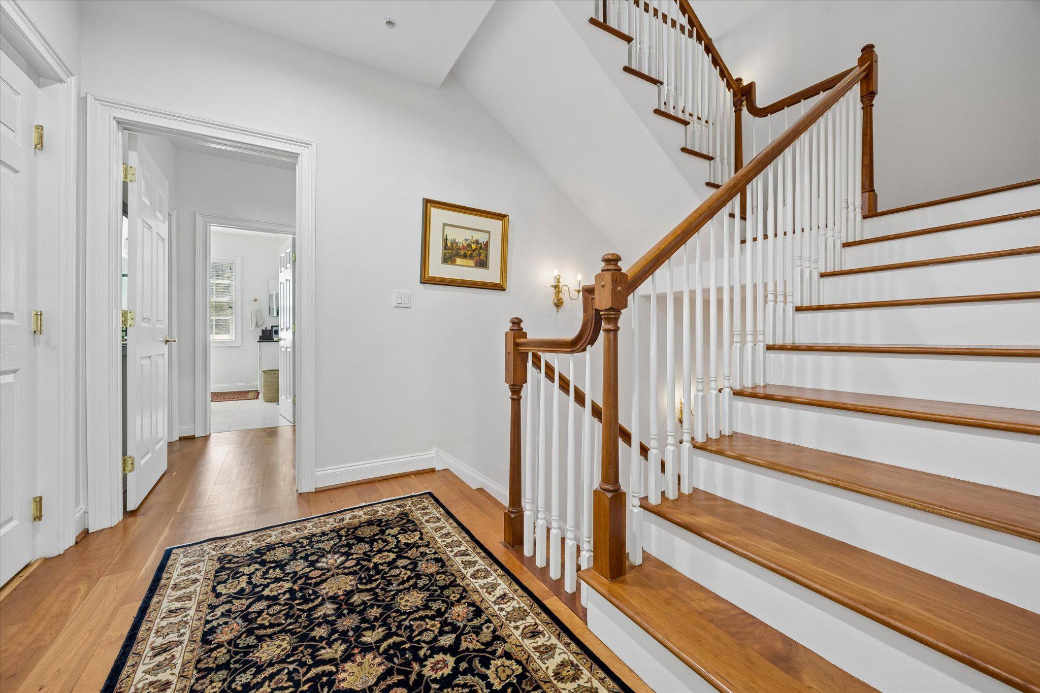126 Bancroft Mills Road, Unit 14 Wilmington, DE 19806 - Photo 13 of 35 a view of staircase with wooden floor and a rug