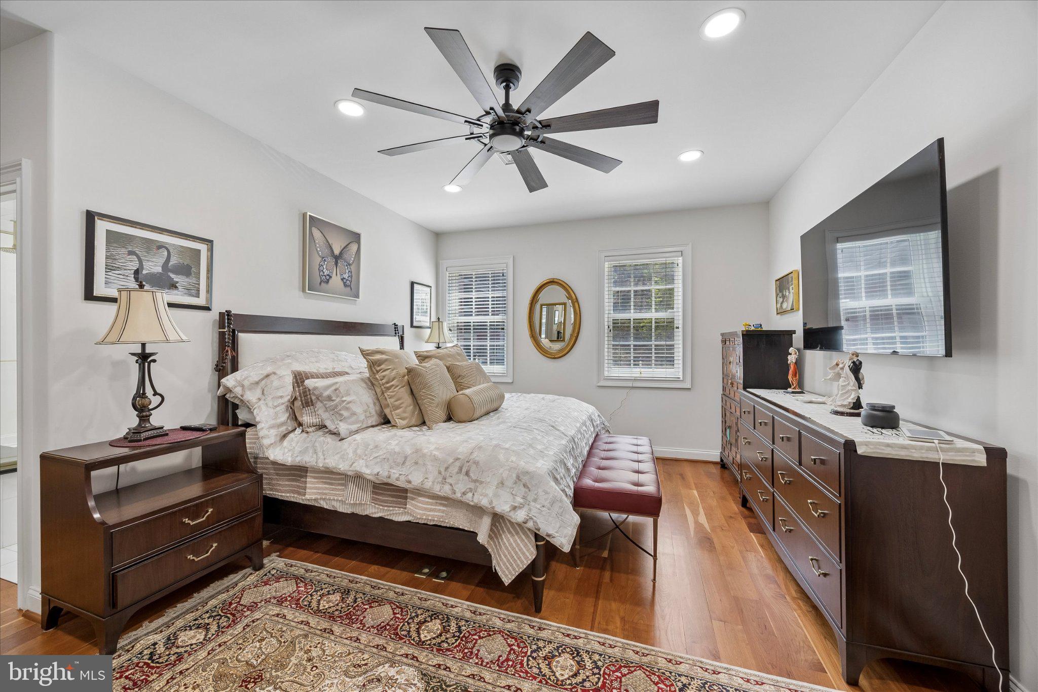 126 Bancroft Mills Road, Unit 14 Wilmington, DE 19806 - Photo 18 of 35 a spacious bedroom with a bed and a chandelier