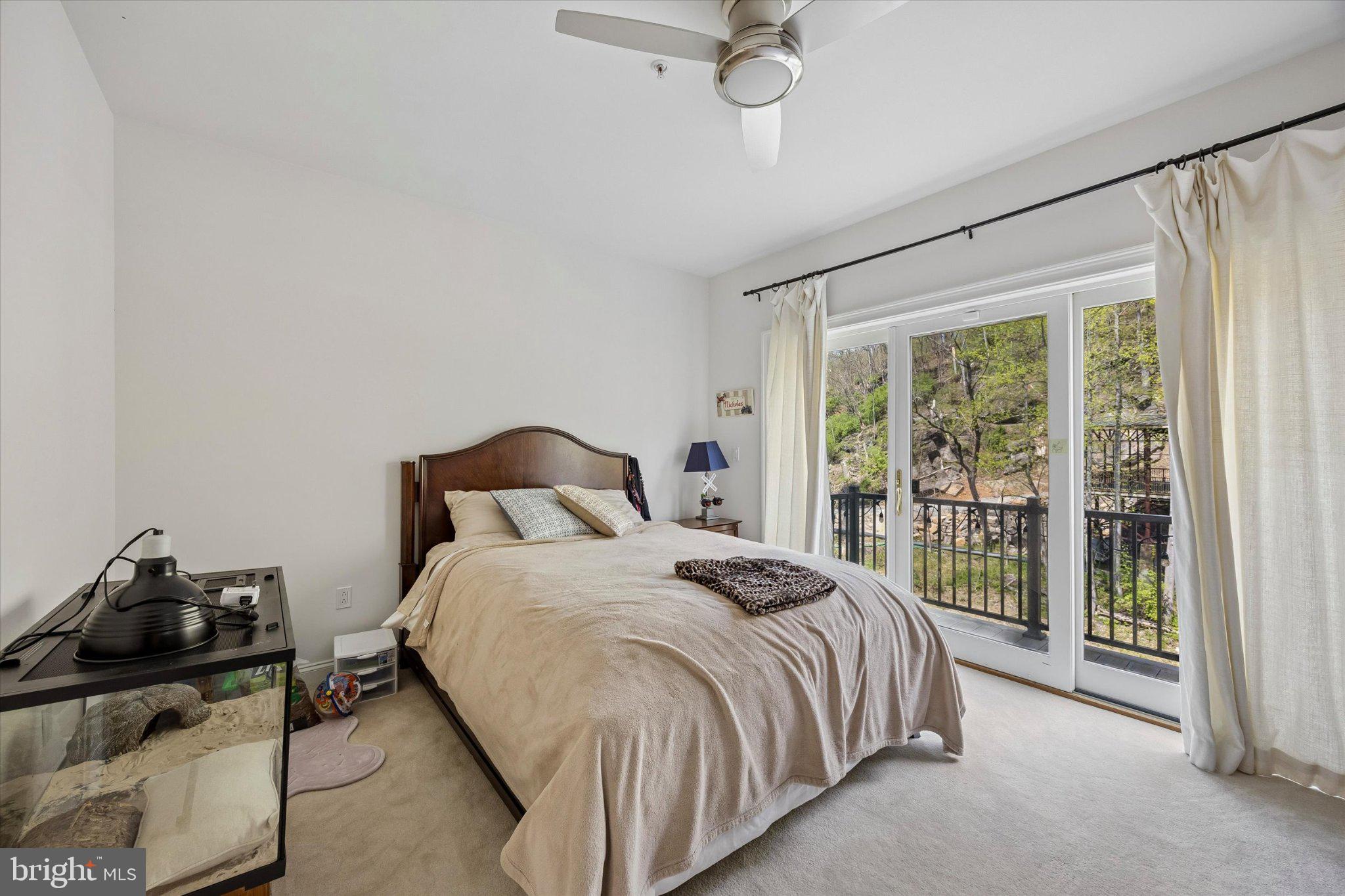 126 Bancroft Mills Road, Unit 14 Wilmington, DE 19806 - Photo 22 of 35 a bedroom with a bed and a window