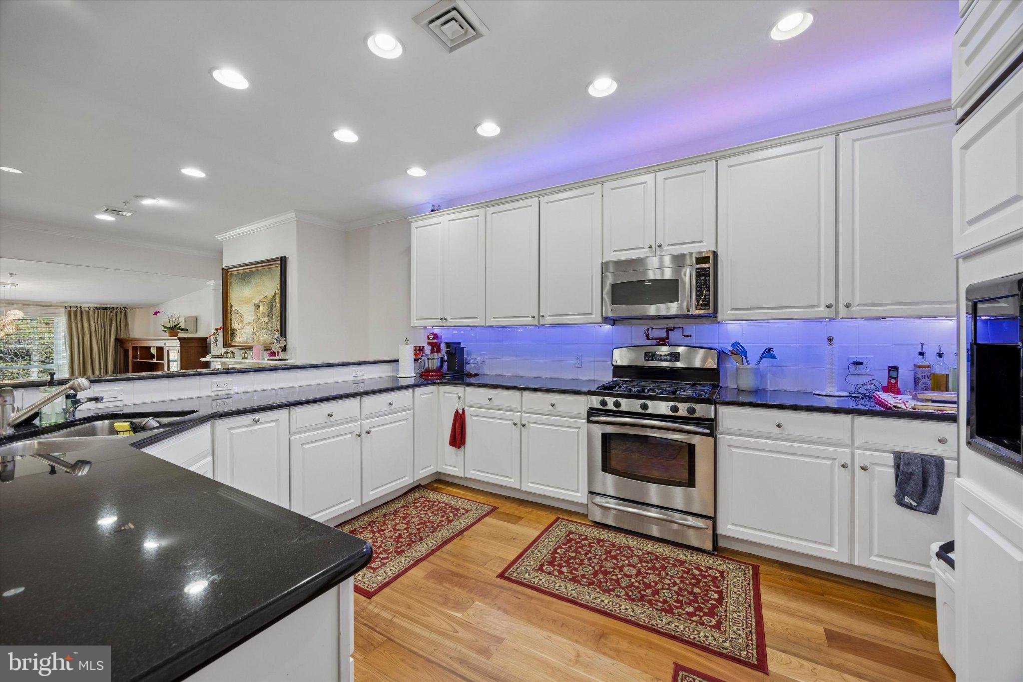 126 Bancroft Mills Road, Unit 14 Wilmington, DE 19806 - Photo 10 of 35 a kitchen with a sink cabinets and stainless steel appliances