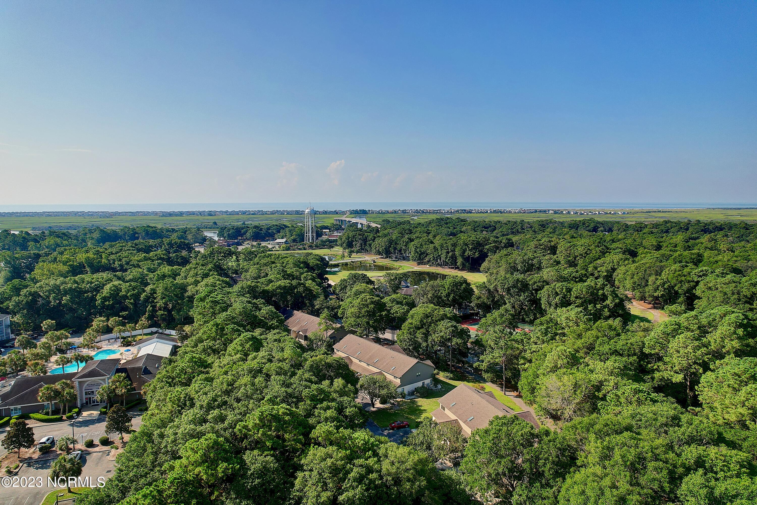 226 Clubhouse Road, Unit 17D Sunset Beach, NC 28468 - Photo 34 of 37 Enjoy a short walk through the live oak trees to the activity center pools, hot tub, fitness center and restaurant.