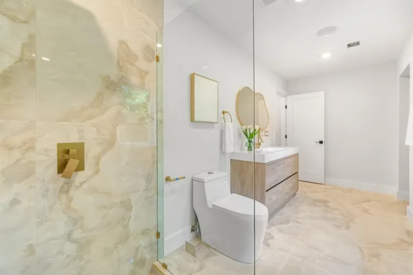 a bathroom with a sink a mirror and a shower