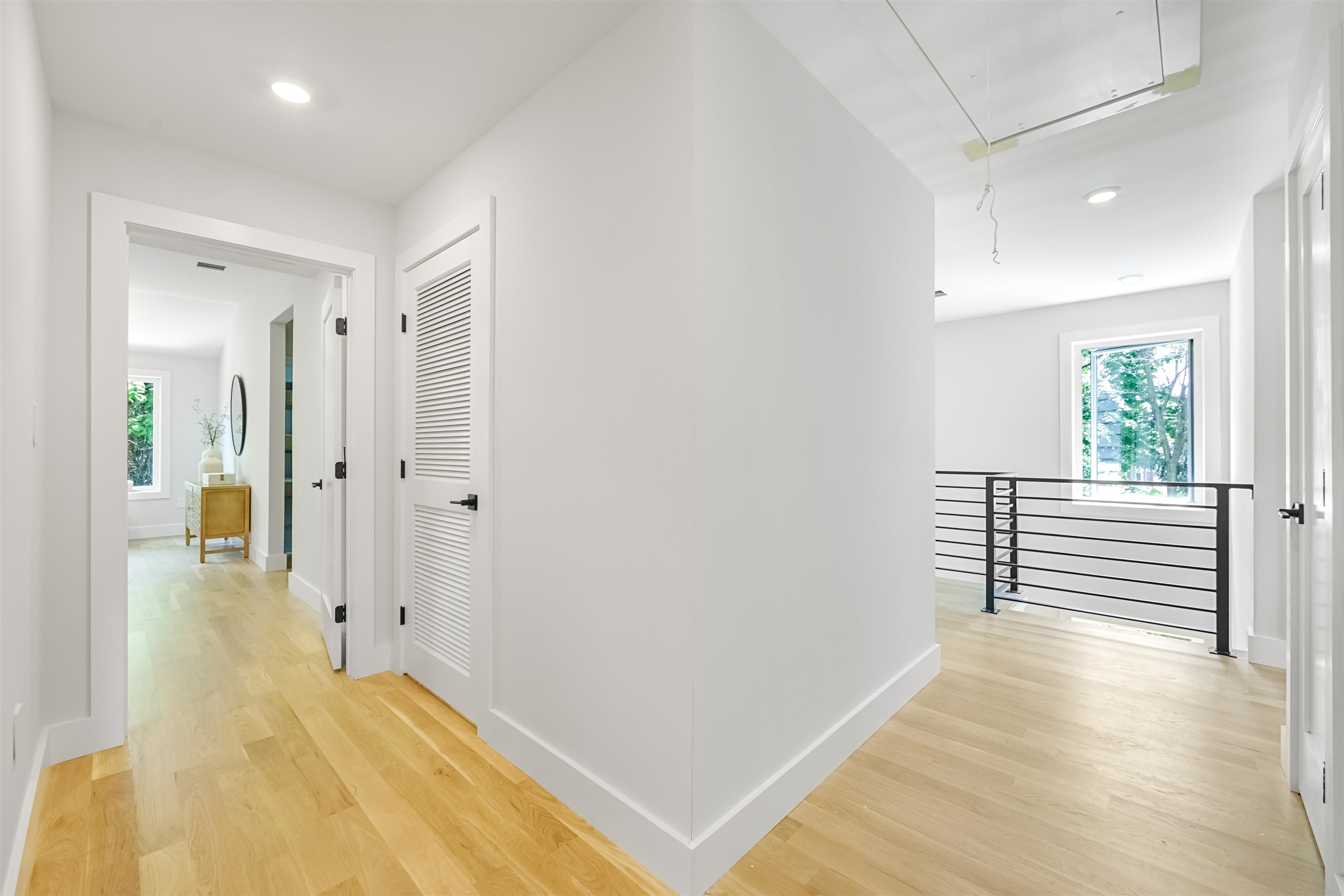 429 Riverside Avenue Rutherford, NJ 07070 - Photo 21 of 26 a view of a hallway with wooden floor and windows
