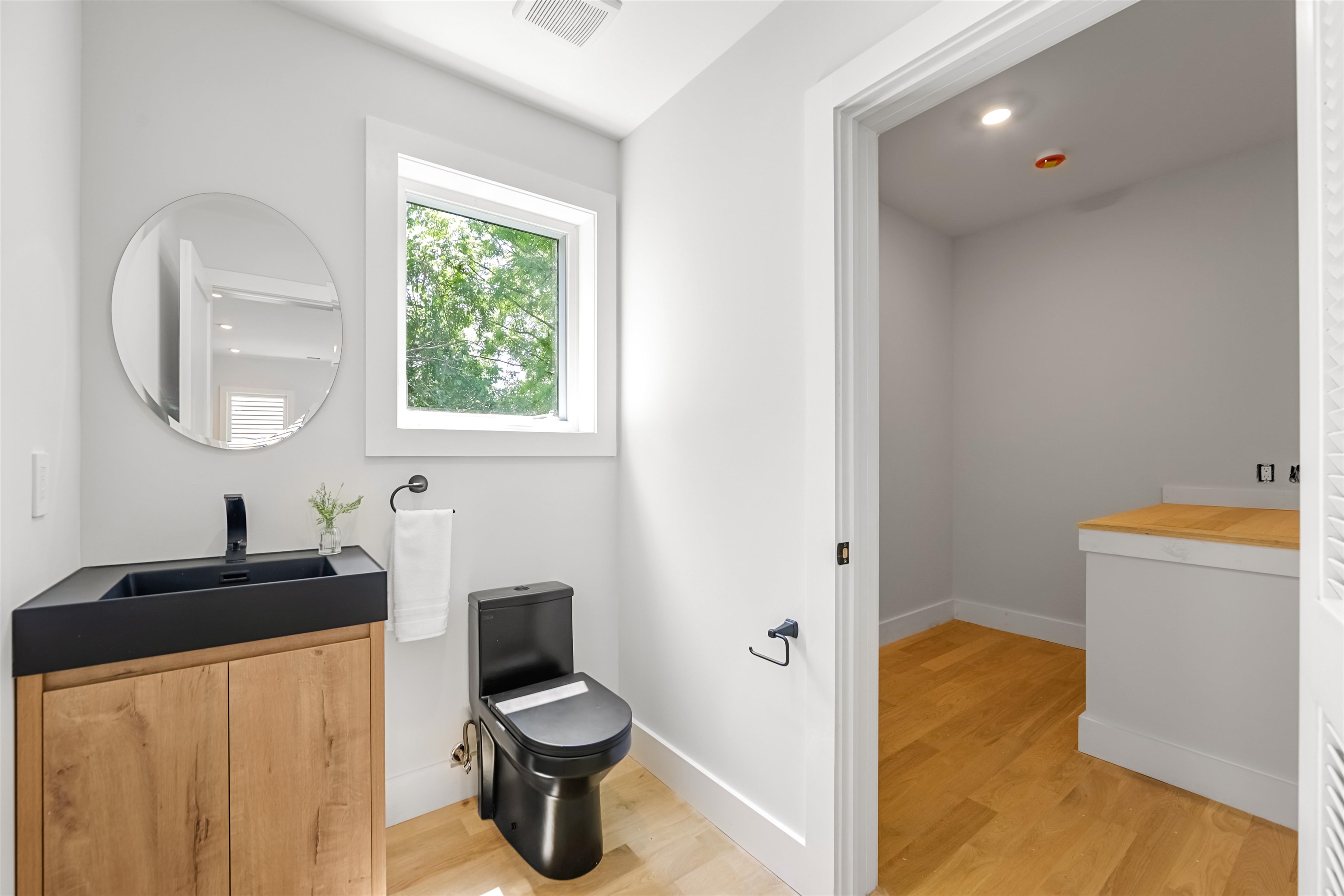 429 Riverside Avenue Rutherford, NJ 07070 - Photo 22 of 26 a bathroom with a toilet sink and mirror