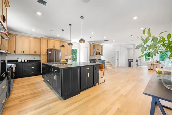 a large kitchen with lots of counter space and windows