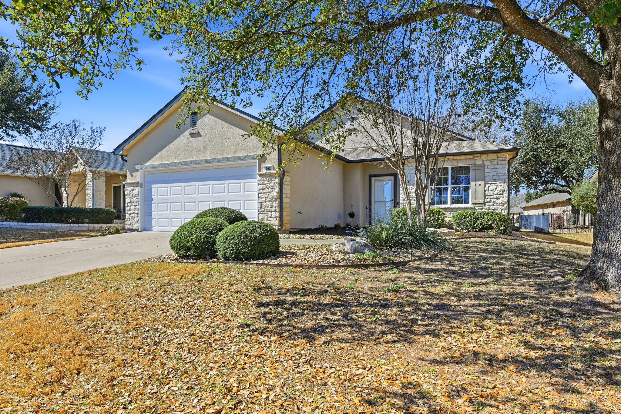View of front of house with beautiful stone work.