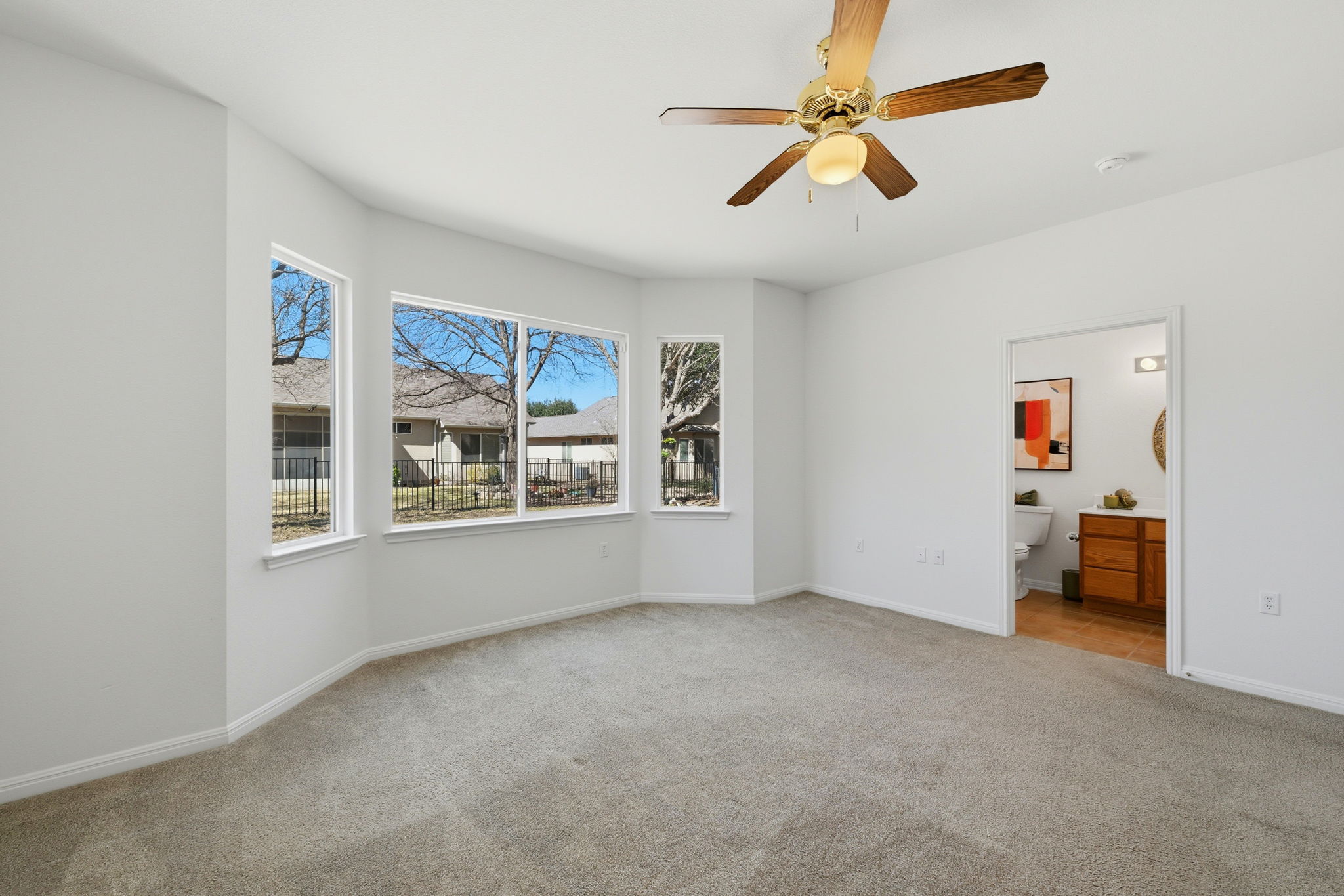 708 Texas Drive Georgetown, TX 78633 - Photo 13 of 27 Spacious primary bedroom, entrance to en-suite.