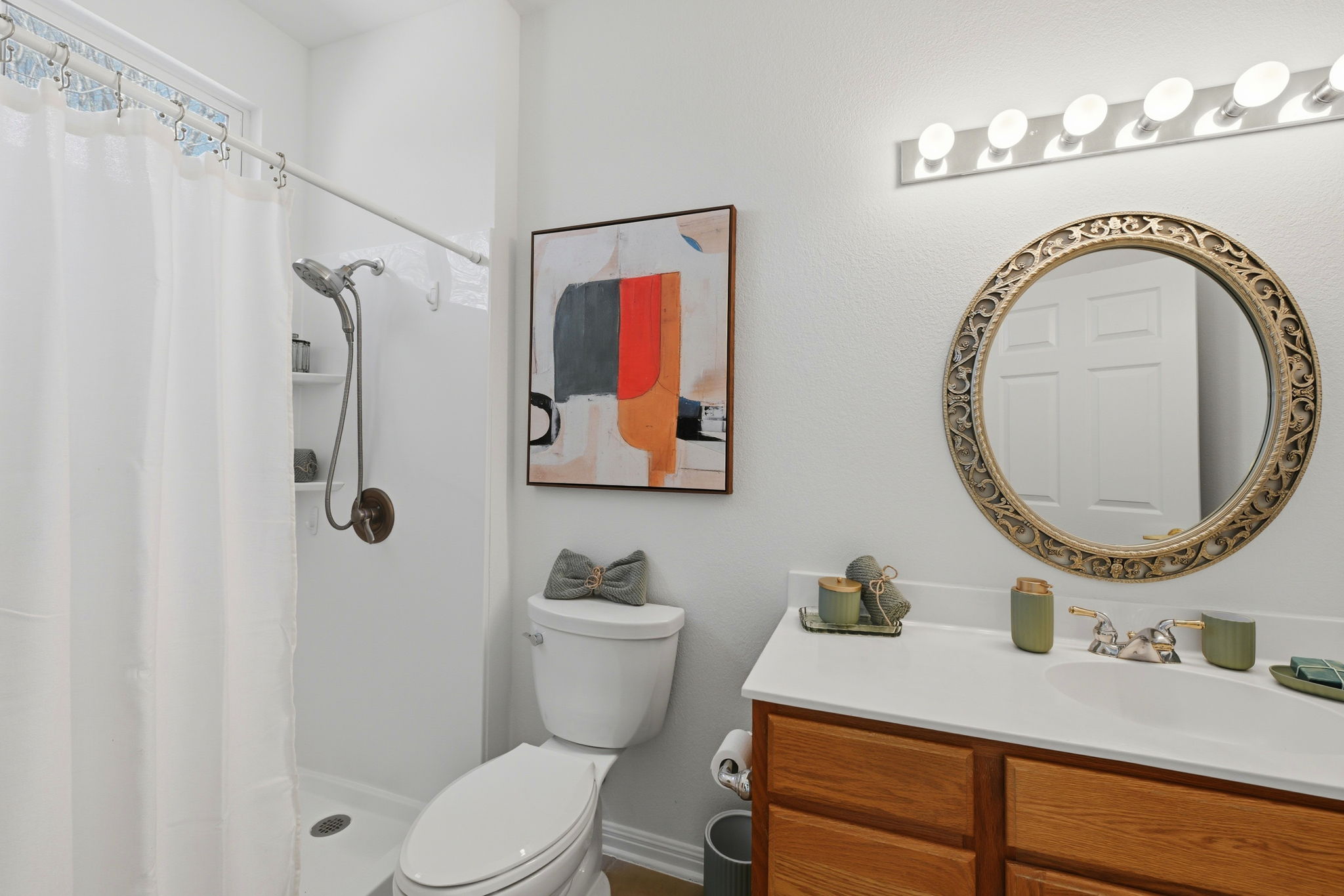708 Texas Drive Georgetown, TX 78633 - Photo 16 of 27 Primary bathroom with lovely designer mirror.