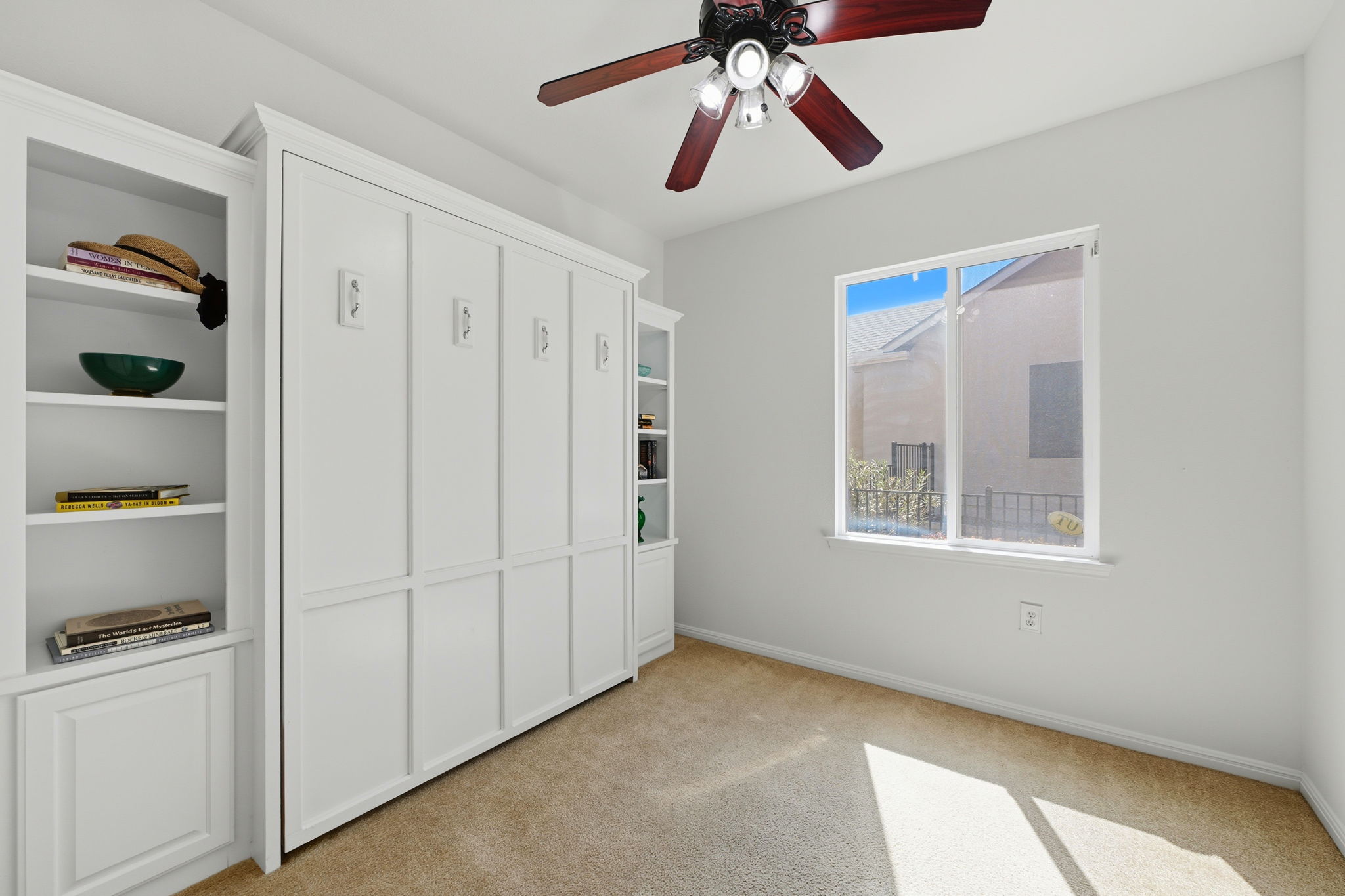 708 Texas Drive Georgetown, TX 78633 - Photo 18 of 27 Second bedroom with Murphy Bed and built in bookcases.