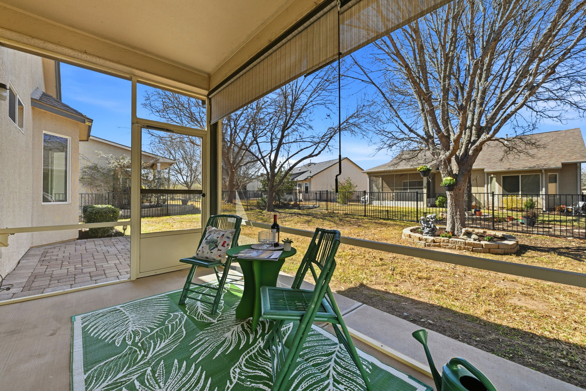 708 Texas Drive Georgetown, TX 78633 - Photo 23 of 27 Extended entertaining space in the lovely screened in patio looking onto the shady back yard.