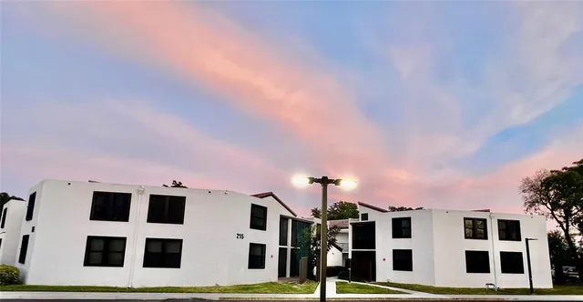 a front view of a building with large windows